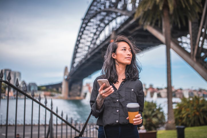 Asian woman using phone in Sydney